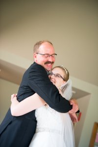 My dad giving me a hug the day of my wedding. 